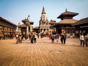 Visitors exploring Kathmandu Durbar Square with historic temples and palace architecture in Kathmandu, Nepal