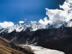Panoramic view of the snow-capped Langtang Lirung mountain peak and Langtang Valley in the Himalayas, Nepal. 