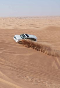 4x4 vehicle dune bashing during Dubai desert safari adventure