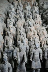 Rows of life-sized Terracotta Warriors standing in Pit 1 of Emperor Qin Shi Huang's Mausoleum in Xi'an, China.