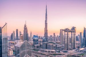 Dubai skyline at sunset with Burj Khalifa towering above modern skyscrapers