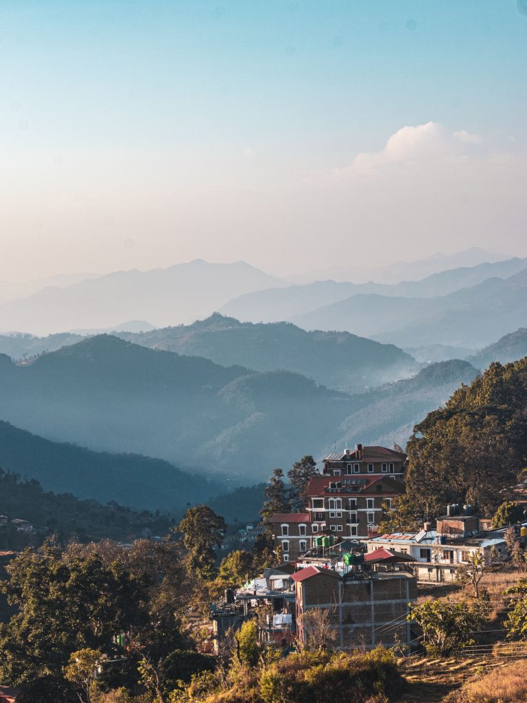 Panoramic view of traditional Newari architecture in Bandipur village, Nepal, nestled against a backdrop of the Mahabharat mountain range.