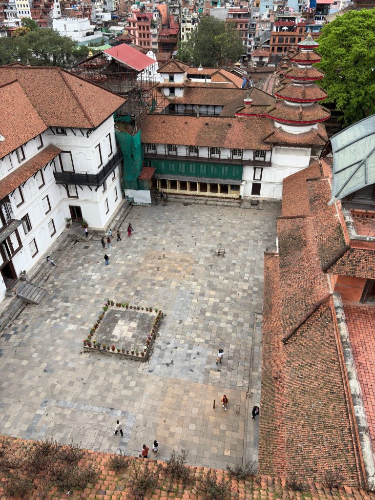Aerial view of the stone-paved Nasal Chowk courtyard and historic Newari architecture at Kathmandu Durbar Square, Nepal.